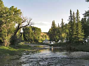 Rocky Mountain National Rendezvous tee pee camp along river photo